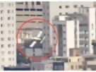 Two people died when a light aircraft collided with a building in Brazil.