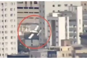 Two people died when a light aircraft collided with a building in Brazil.